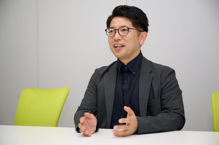 「AiCANサービス」について説明する髙岡氏