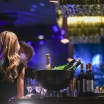 One new AI dating app is inviting users out for champagne and caviar bumps giving them an envelope revealing who the AI matchmaker has paired them up with.